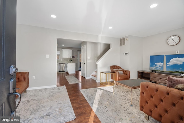 living room with dark hardwood / wood-style flooring