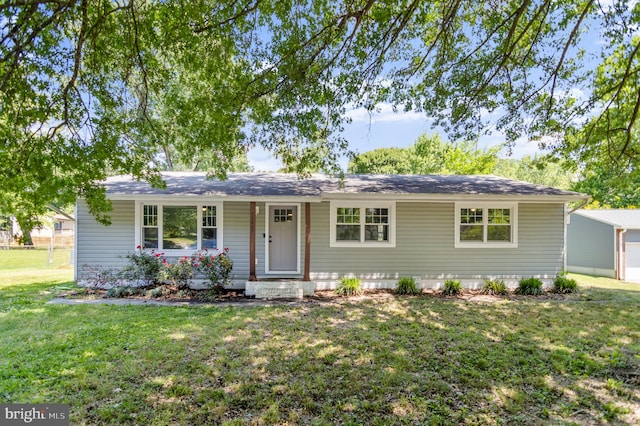 ranch-style home with a front lawn