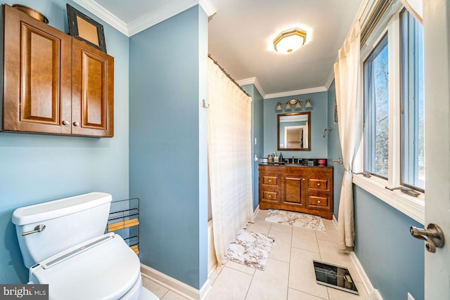 bathroom featuring tile patterned flooring, vanity, crown molding, and toilet