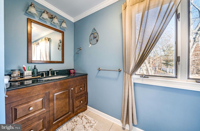 bathroom featuring tile patterned flooring, crown molding, and vanity