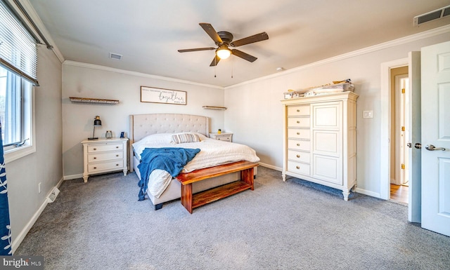 bedroom featuring crown molding, carpet floors, and ceiling fan