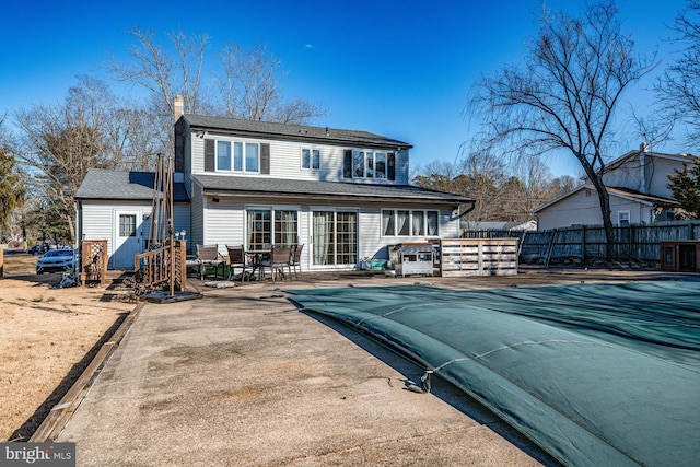 rear view of house with a patio