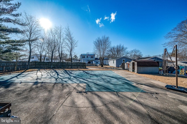 view of pool featuring a storage shed