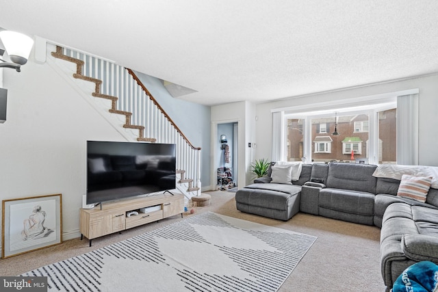 living room with light colored carpet and a textured ceiling