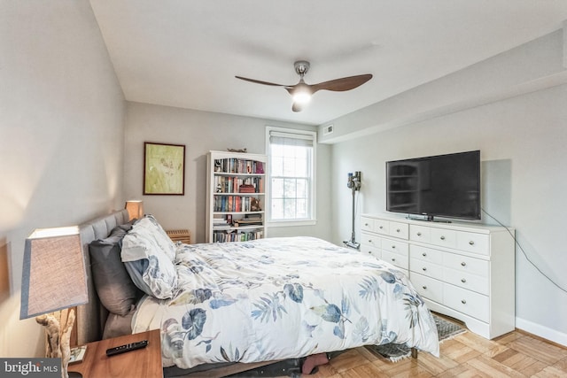 bedroom featuring ceiling fan and light parquet flooring