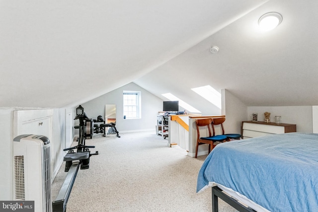 bedroom featuring light carpet and vaulted ceiling