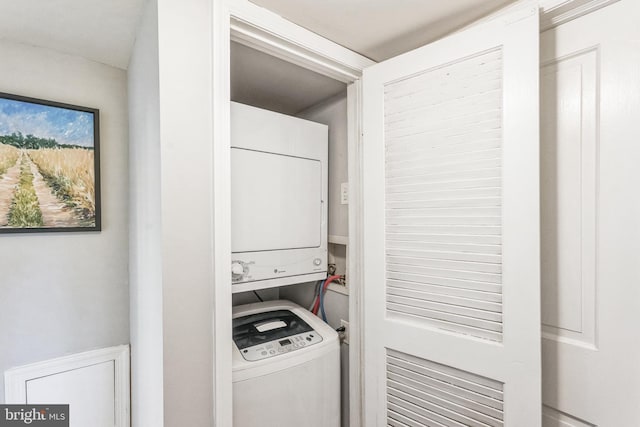 laundry area featuring stacked washer and dryer