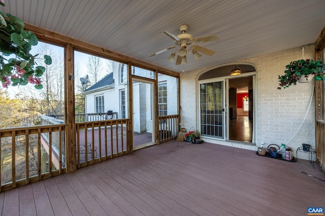 wooden deck featuring ceiling fan