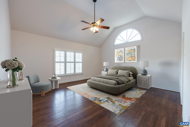 bedroom with high vaulted ceiling, dark wood-type flooring, and ceiling fan