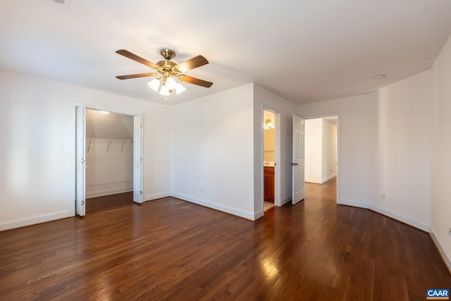 unfurnished room with ceiling fan and dark hardwood / wood-style flooring