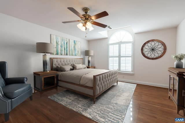 bedroom with dark wood-type flooring and ceiling fan