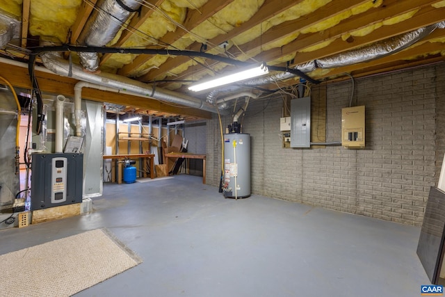 basement with gas water heater, electric panel, and brick wall