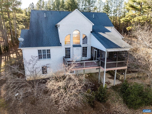 back of house featuring a deck