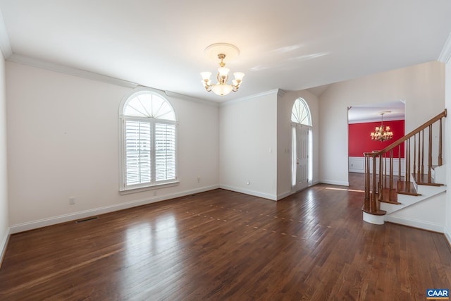 interior space featuring an inviting chandelier, dark hardwood / wood-style floors, and crown molding