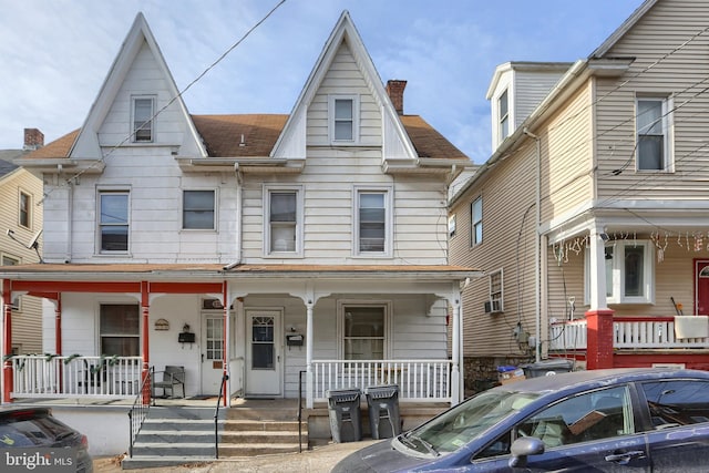 view of property featuring covered porch