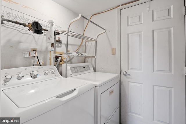 laundry room with washer and clothes dryer