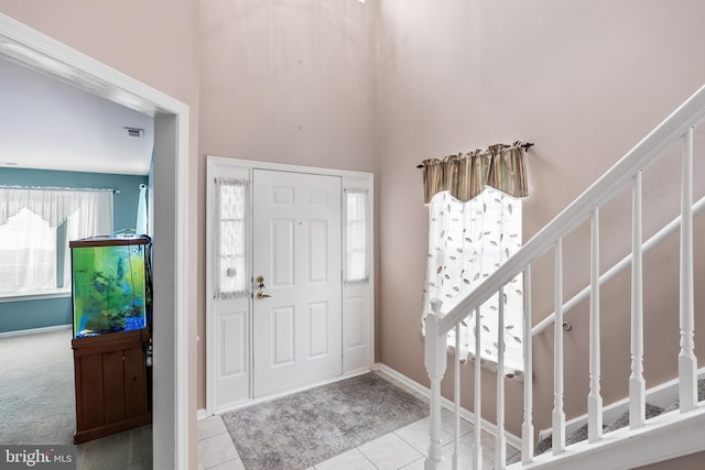 entryway with light tile patterned floors