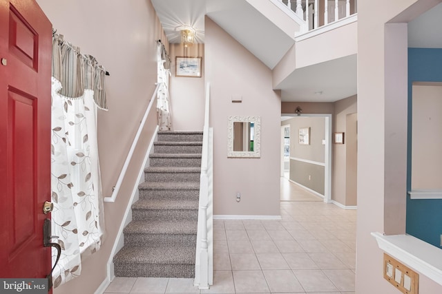 entryway with light tile patterned floors