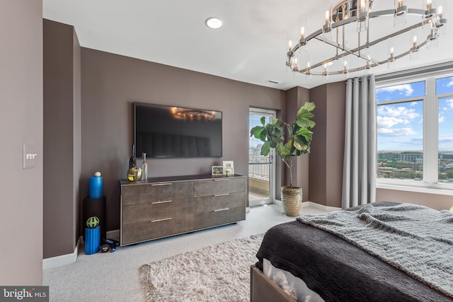 bedroom with carpet floors and multiple windows