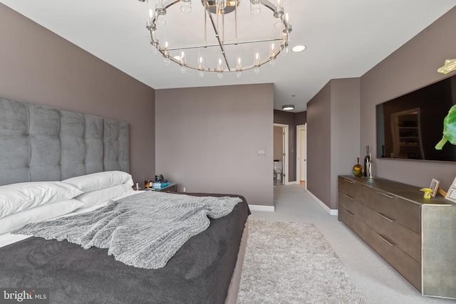 bedroom with light carpet and a chandelier