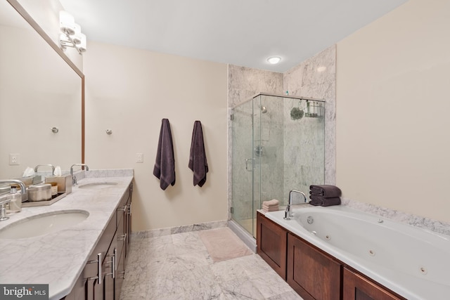 bathroom featuring vanity and independent shower and bath