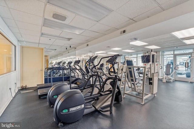 workout area with a drop ceiling