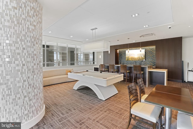 playroom with indoor bar, pool table, and wood walls