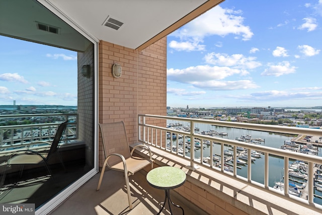 balcony featuring a water view