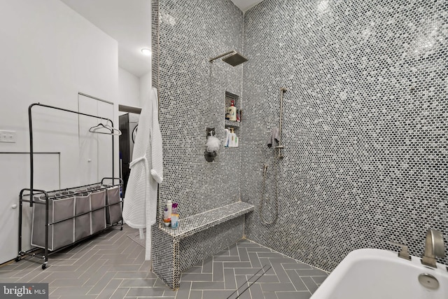 full bath featuring a tile shower