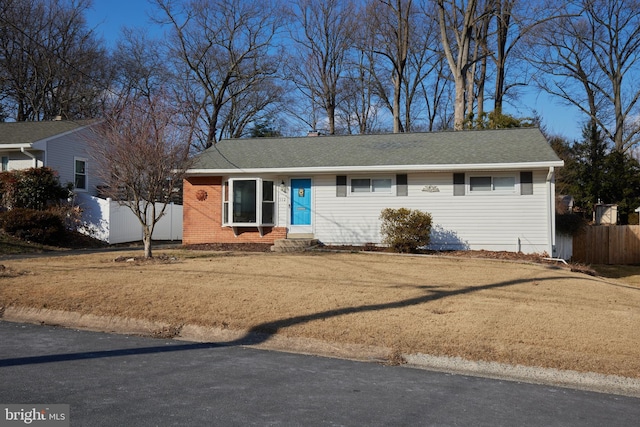 single story home featuring a front yard