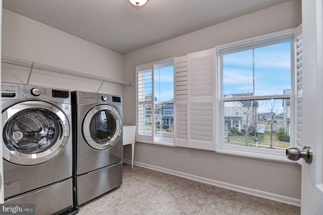 laundry room with separate washer and dryer