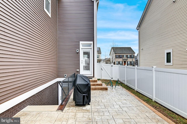 view of patio featuring a grill