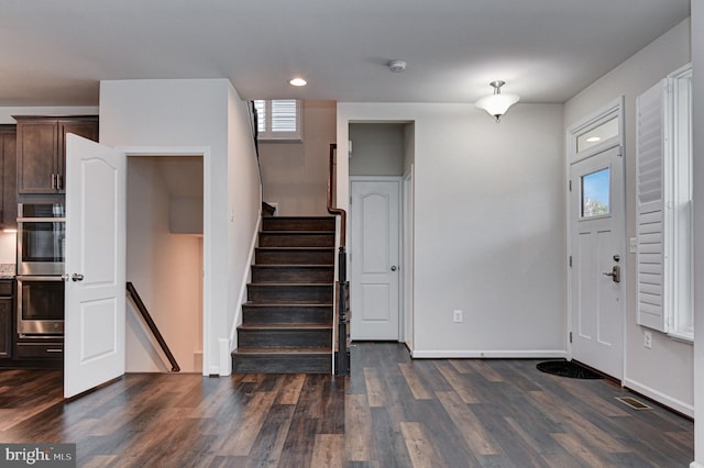 foyer with dark hardwood / wood-style flooring