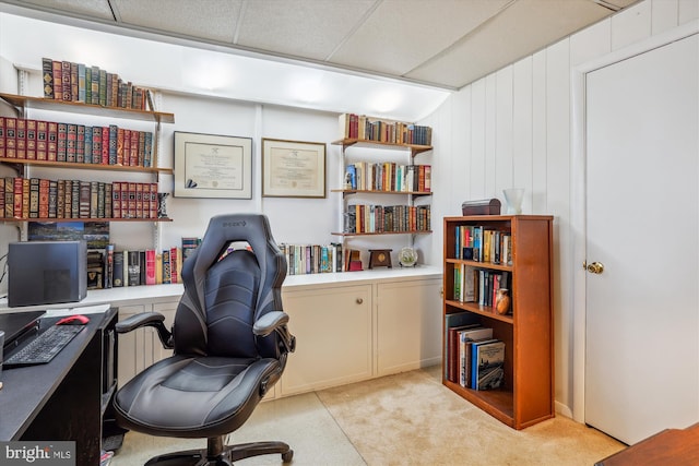 office area with carpet and a drop ceiling