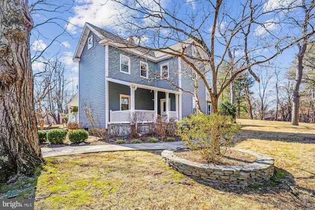 view of front of home featuring a porch and a front yard