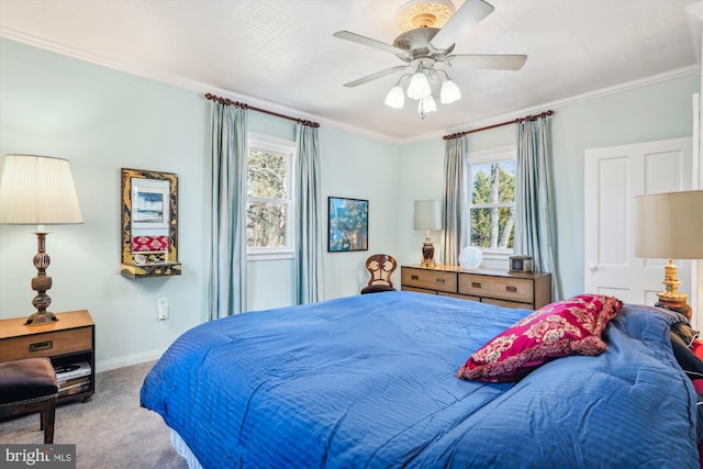 bedroom with baseboards, carpet floors, a ceiling fan, and crown molding