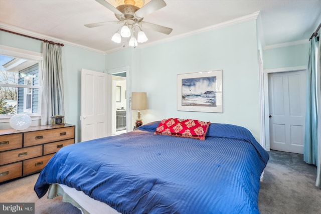 bedroom featuring ceiling fan, carpet floors, and ornamental molding