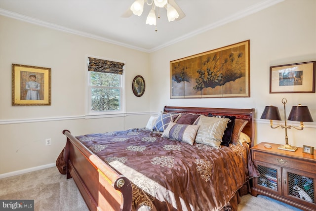 carpeted bedroom featuring ceiling fan, ornamental molding, and baseboards