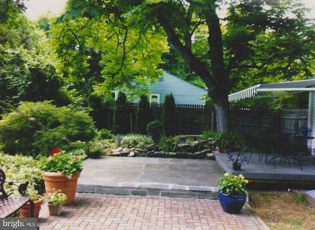 view of patio featuring fence