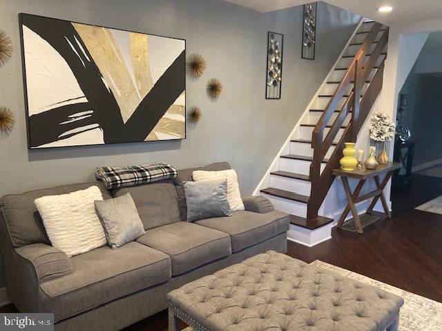 living room featuring dark hardwood / wood-style flooring