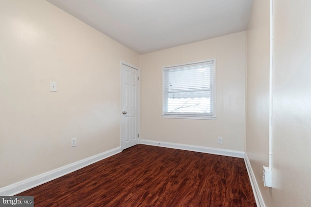 spare room with hardwood / wood-style floors