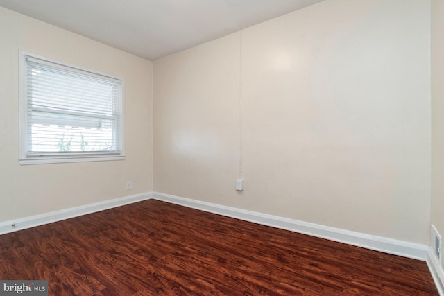 unfurnished room featuring hardwood / wood-style flooring