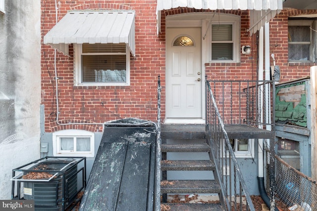 doorway to property with central AC unit