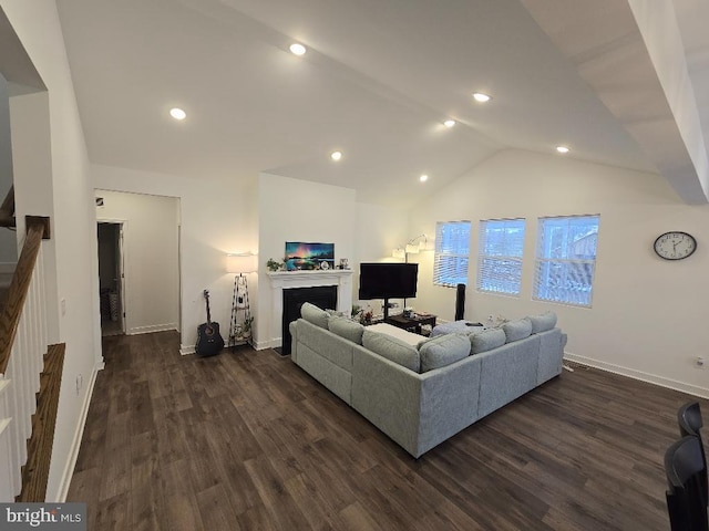 living room featuring dark hardwood / wood-style floors and vaulted ceiling