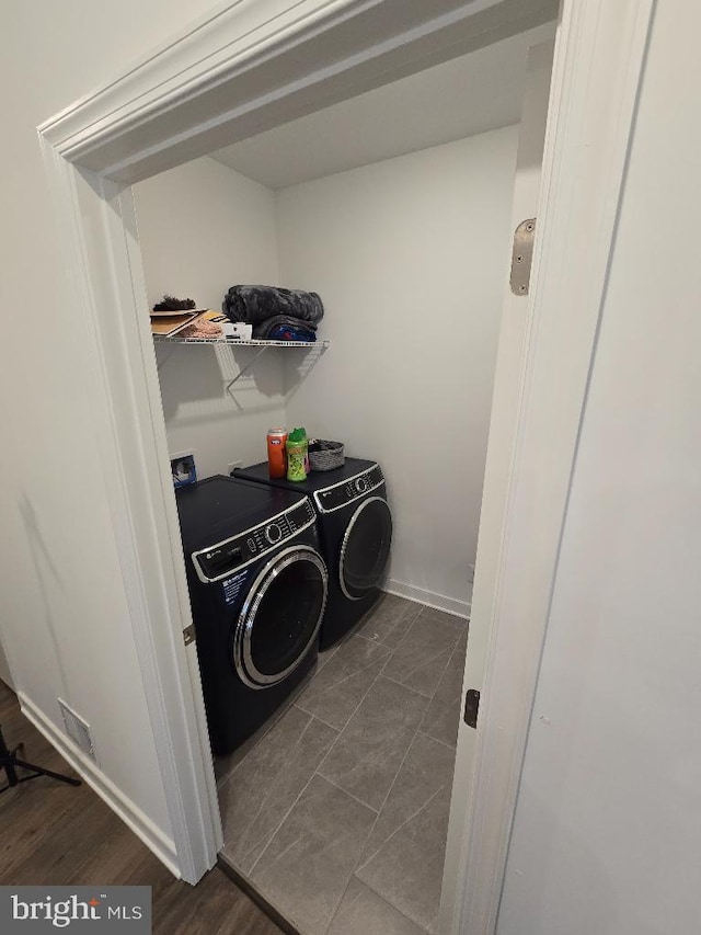 washroom featuring washer and dryer