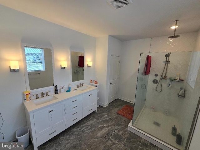 bathroom with an enclosed shower and vanity