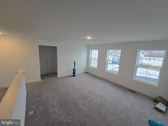 empty room featuring carpet floors