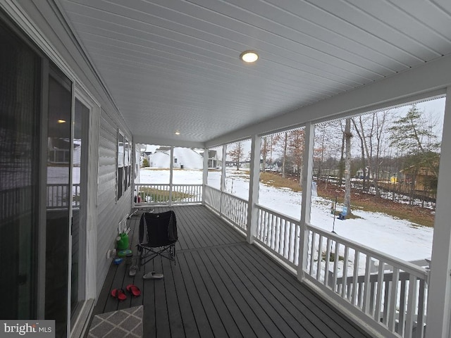 view of snow covered deck