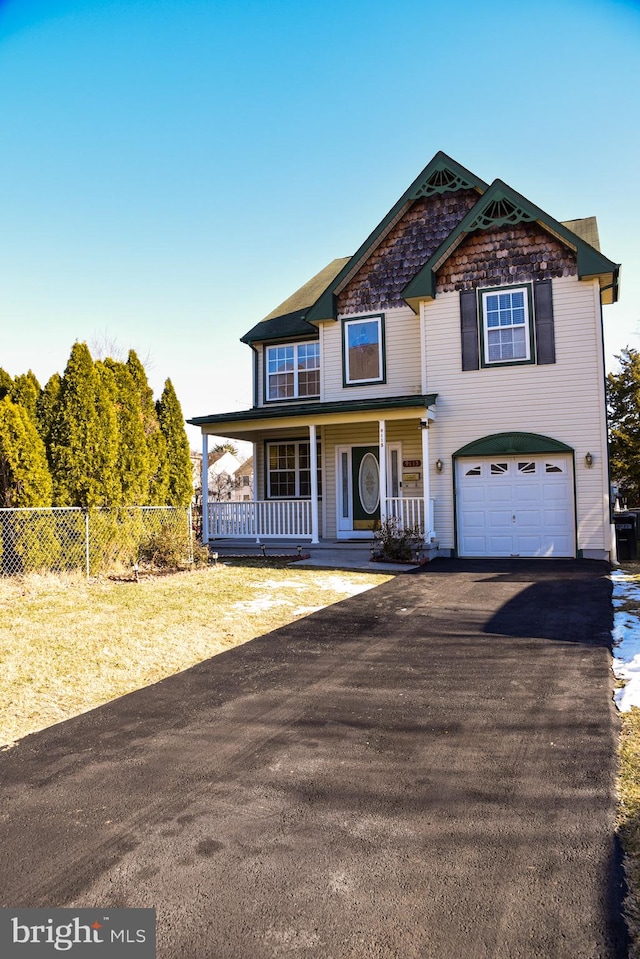 view of front of house with a garage and covered porch