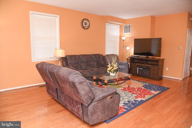 living room with light hardwood / wood-style floors